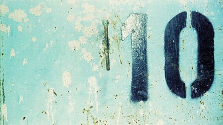 Close up photography of a weathered metal wall with rust and peeling paint..の写真素材