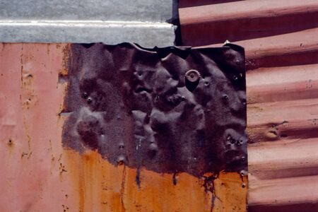 Close up photography of a rusty metal wall