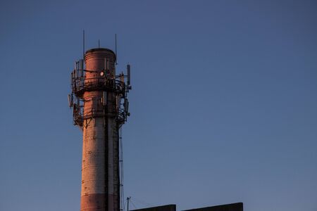 Boiler room chimney with the blue sky on backgroundの写真素材