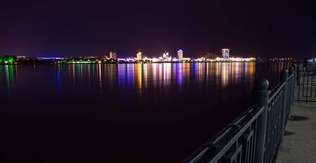 Embankment at night, the reflection of city lightsの写真素材