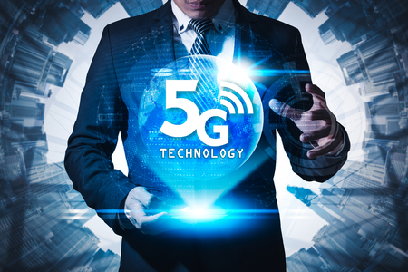 The abstract image of businessman using a smartphone overlay with 5g hologram.の写真素材