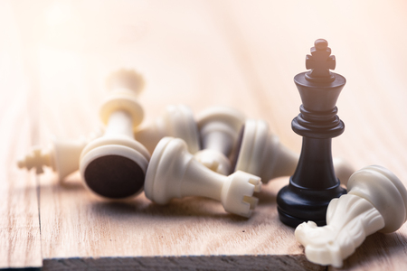 the abstract image of the chess set which has the king placed on chess board and the another in chess set placed around. the concept of strategy, victory, business, win, games, intelligence.の写真素材