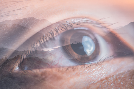 The double exposure image of the eye looking up overlay with nature image. The concept of nature, freedom, environment and business.の写真素材