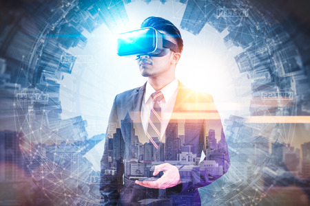 The abstract double exposure image of businessman using a smart glasses or vr glasses overlay with...