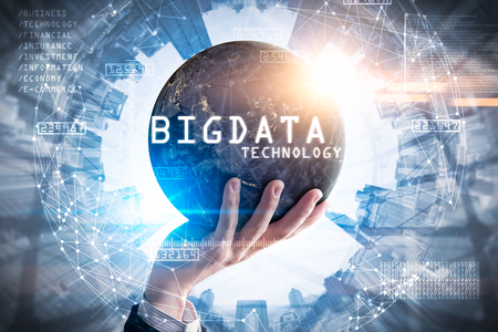 The double exposure image of the businessman hold the big data hologram on handの写真素材