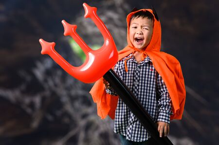 the abstract image of the boy in the Halloween costume. the concept of Halloween, festival, October, and childhood.の写真素材