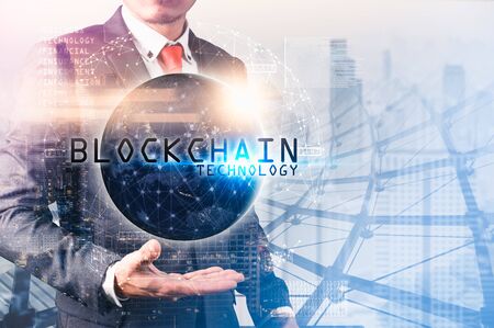 The abstract image of the business man hold the blockchain hologram on hand and element of this image furnished by Nasa. the concept of cryptocurrency, blockchain, internet of things and future lifeの写真素材