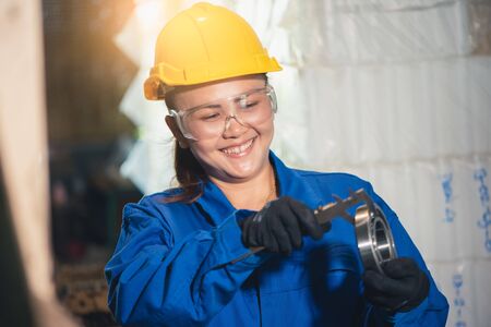 the abstract image of the technician maturing the ball bearing in the industrial factory. the...