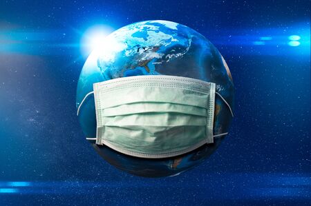 the abstract image of the planet earth wearing a medical mask on the space and element of this image furnished by Nasa. the concept of coronavirus, covit-19, medical and healthcare.の写真素材