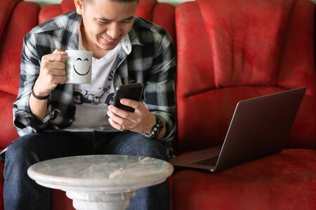 the abstract image of the man is quarantining himself and use video conference method at his home office. the concept of covid-19, work at home, quarantine, healthcare and business.の写真素材