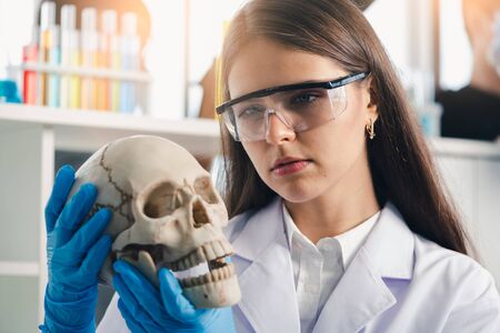 the scientists are analyzing the component models of the human body in the laboratory. the concept of coronavirus, vaccination, laboratory and medical.の写真素材