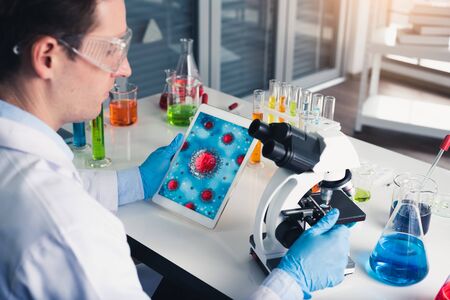 the scientists are hard-working for Invented the anti-coronavirus vaccine formula in the laboratory. the concept of coronavirus, vaccination, laboratory and medical.の写真素材