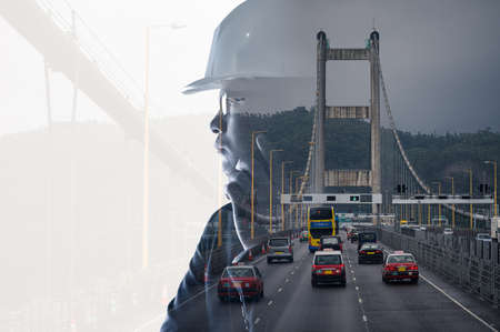 The double exposure image of the engineer standing back during sunrise overlay with cityscape image. The concept of engineering, construction, city life and future.の写真素材