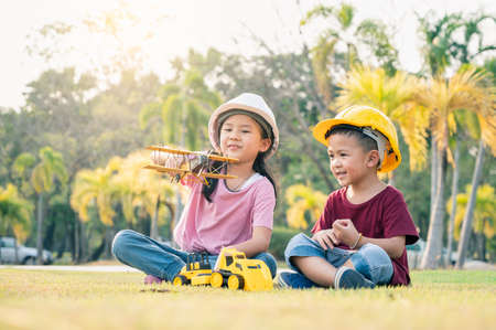 the kids acting as are engineer in the park. the concpet of the education, intelligence playful and...