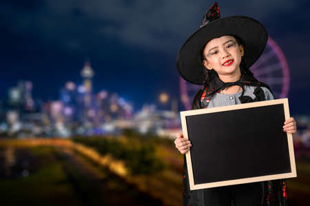 the childrens in the Halloween costume. the concept of Halloween, festival, party and happiness