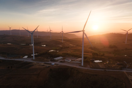 the wind turbines field and the sunrise. the concept of clean energy, environment, electricity and Industrialの写真素材