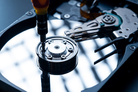 the technician repairing inside of hard disk
