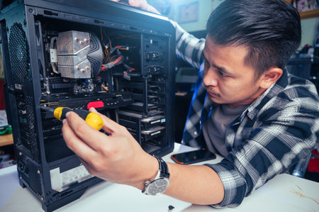 The technician repairing the computer. the concept of computer, CPU, motherboard, hardware, repairing, upgrade and technology.の写真素材