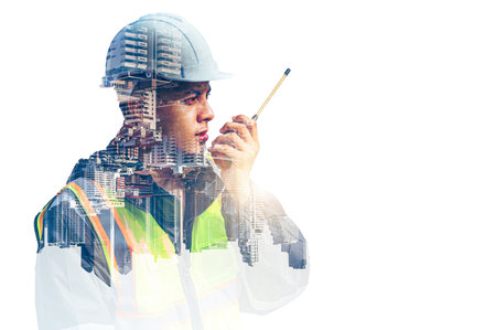 The double exposure image of the engineer thinking overlays with cityscape image with copy space....