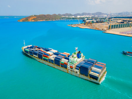 the image provides a stunning aerial view of a bustling cargo ship port, where massive vessels dock and unload their precious cargo.の写真素材