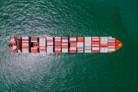 the image provides a stunning aerial view of a bustling cargo ship port, where massive vessels dock and unload their precious cargo.の写真素材