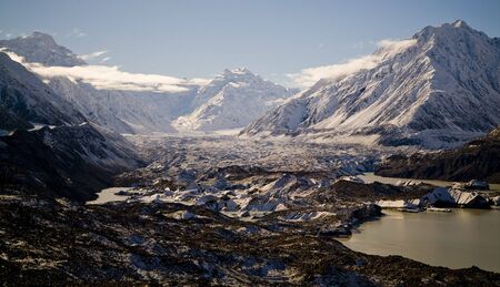 Snow, ice, rock, mountains and plenty of water on the Tasman Glacier.の写真素材