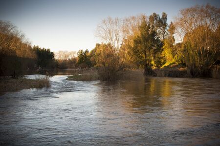 Wide section of creek in fading afternoon light