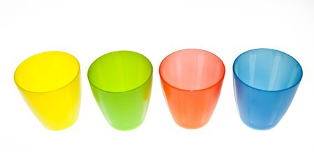 Group of brightly coloured plastic cupsの写真素材