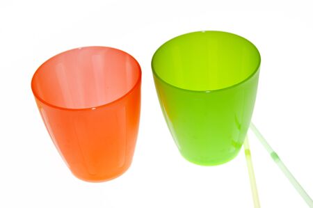 Group of brightly coloured plastic cupsの写真素材