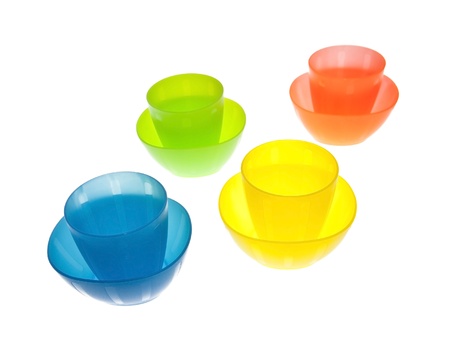 Group of brightly coloured plastic cupsの写真素材