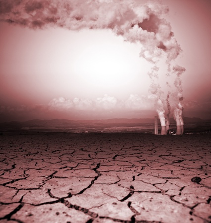 Badly cracked earth with power stationの写真素材