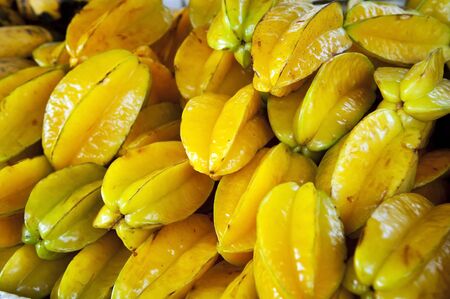 Tropical star fruit in a pileの写真素材