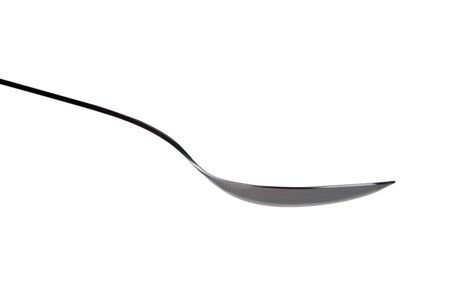 Stainless steel spoon isolated over white side onの写真素材