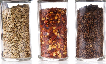 Spice jars with fennel, chili and cardamom