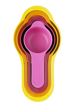 Nested measuring cups in four different sizes isolated on whiteの写真素材