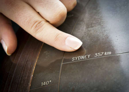 Finger pointing to Sydney, Australia