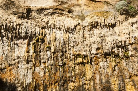 Stalactite and other cave formations hanging from the ceiling