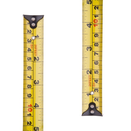 Tape measure in millimetres and inches isolated on white