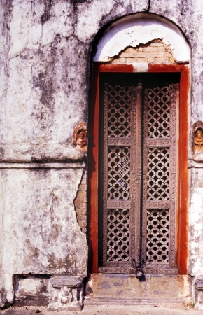 Intricate doorway of wood and stone in Indiaの写真素材