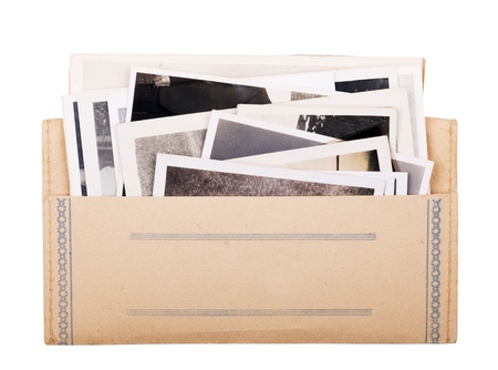 Old black and white photos in a vintage photo wallet isolated on whiteの写真素材