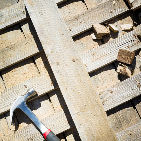 Timber off-cuts, sawdust and tools on a construction siteの写真素材
