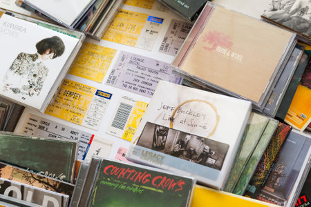 SOUTH AUSTRALIA, AUSTRALIA - AUGUST 8, 2014 - Concert tickets from world famous bands with music CD's のeditorial素材
