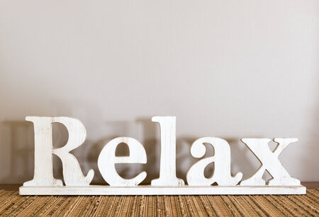 Relax written in large wooden letters with copy spaceの写真素材