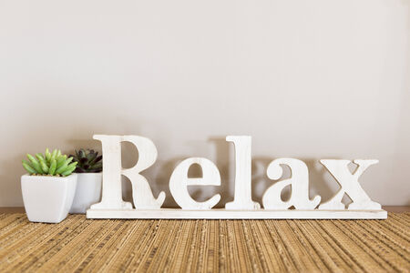 Relax written in large wooden letters with copy spaceの写真素材