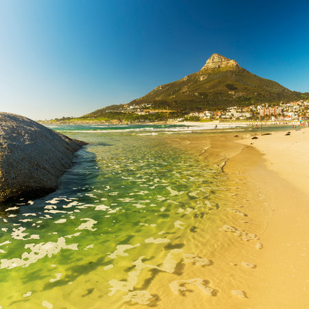 CAMPS BAY, SOUTH AFRICA - 5 OCTOBER 2015: Unidentified people on Camps Bay beach in Cape Town, South Africa, with Lion's Head peak behind.のeditorial素材