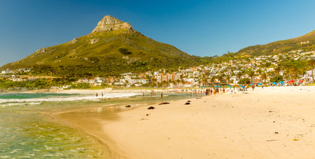 CAMPS BAY, SOUTH AFRICA - 5 OCTOBER 2015: Unidentified people on Camps Bay beach in Cape Town, South Africa, with Lion's Head peak behind.のeditorial素材
