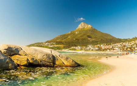 CAMPS BAY, SOUTH AFRICA - 5 OCTOBER 2015: Unidentified people on Camps Bay beach in Cape Town, South Africa, with Signal Hill in view.のeditorial素材