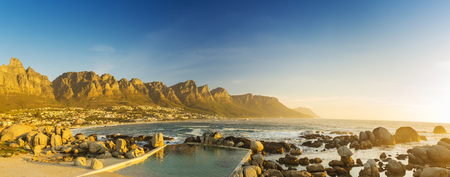sunset panorama of camps bay cape town in south africaの写真素材