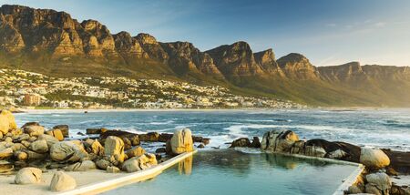 sunset panorama of camps bay cape town in south africaの写真素材