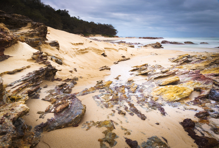 Australian ocean landscape scenic at dawn with wet rocks on Stradbroke Islandの写真素材